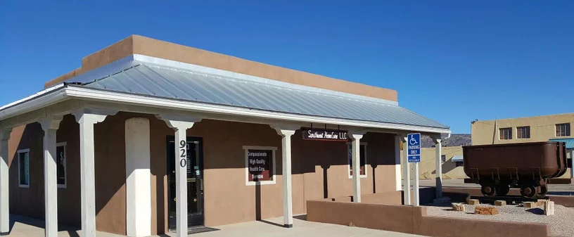The Southwest Home Care LLC office at 920 E. Santa Fe Ave. in Grants, New Mexico, with a mine ore cart out front